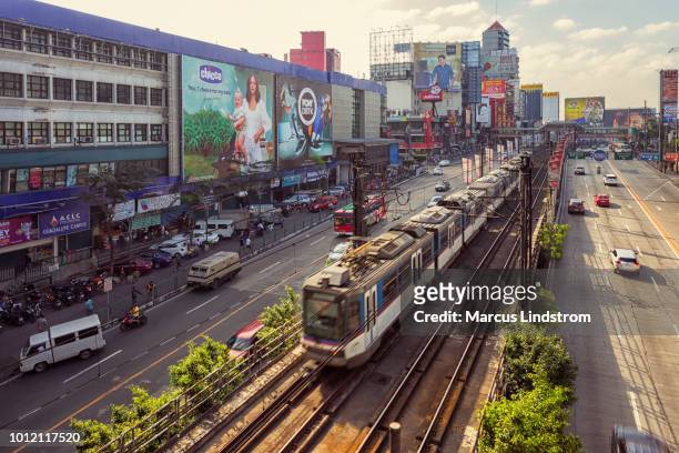 mrt train in manila - makati stock pictures, royalty-free photos & images