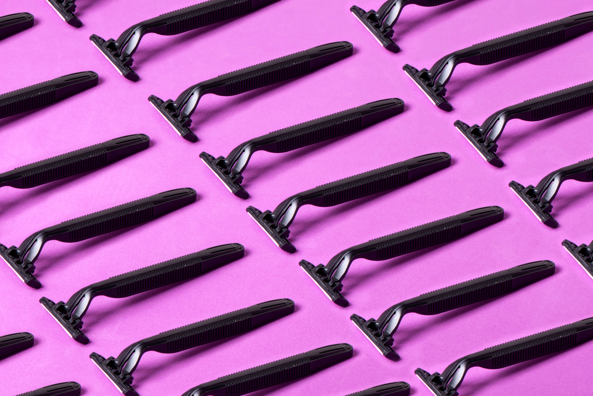 Razor Blades On Purple Background Razor Blades On Purple Background