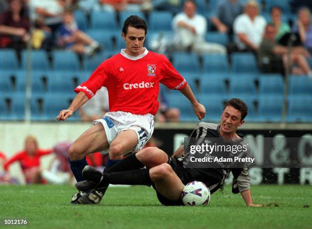 Riki Van Steeden of the Kingz and Tom Pondeljak of United fight for the ball during the match between Sydney United v Auckland Kingz at the Sydney...