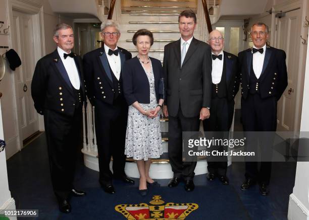 Princess Anne, Princess Royal, Admiral of the Royal London Yacht Club poses with Commodore David Gower and Vice Commodore HH Judge N Jones , Rear...