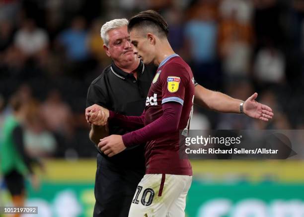 Steve Bruce the Aston Villa manager with Aston Villa's Jack Grealish during the Sky Bet Championship match between Hull City and Aston Villa at the...