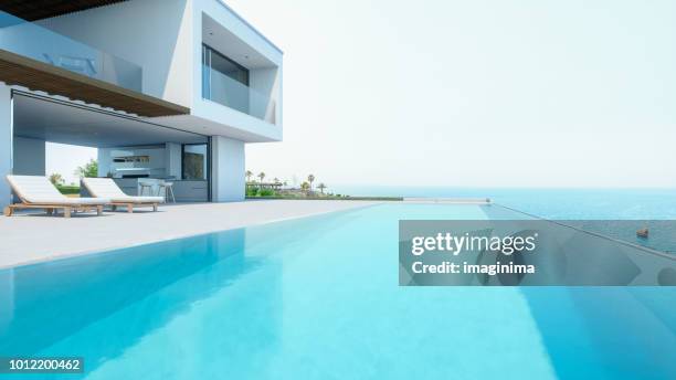 luxury holiday villa with infinity pool - minimal villa pool white stock pictures, royalty-free photos & images