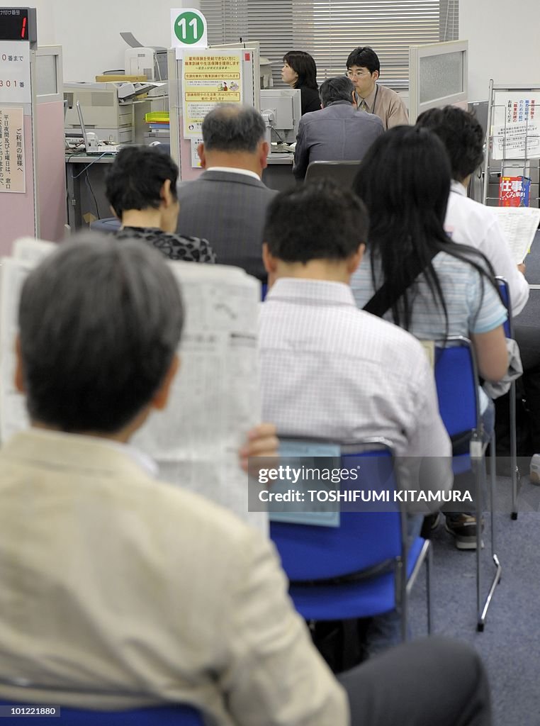 Job seekers await for an interview at th