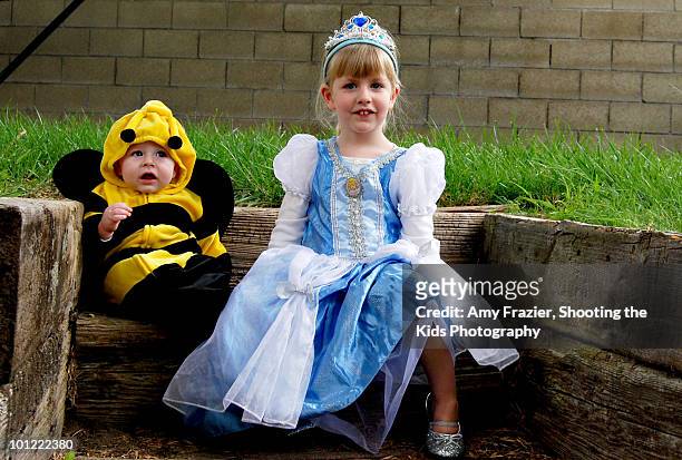two children dressed up in costumes - boy tiara stock pictures, royalty-free photos & images