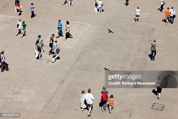 people walking in a road - people aerial view stockfoto's en -beelden