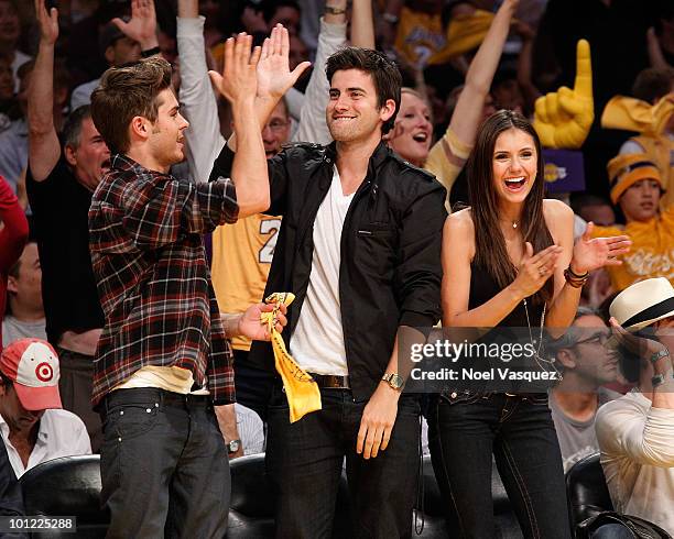 Zac Efron, Ryan Rottman and Nina Dobrev attend Game Five of the Western Conference Finals between the Phoenix Suns and the Los Angeles Lakers during...