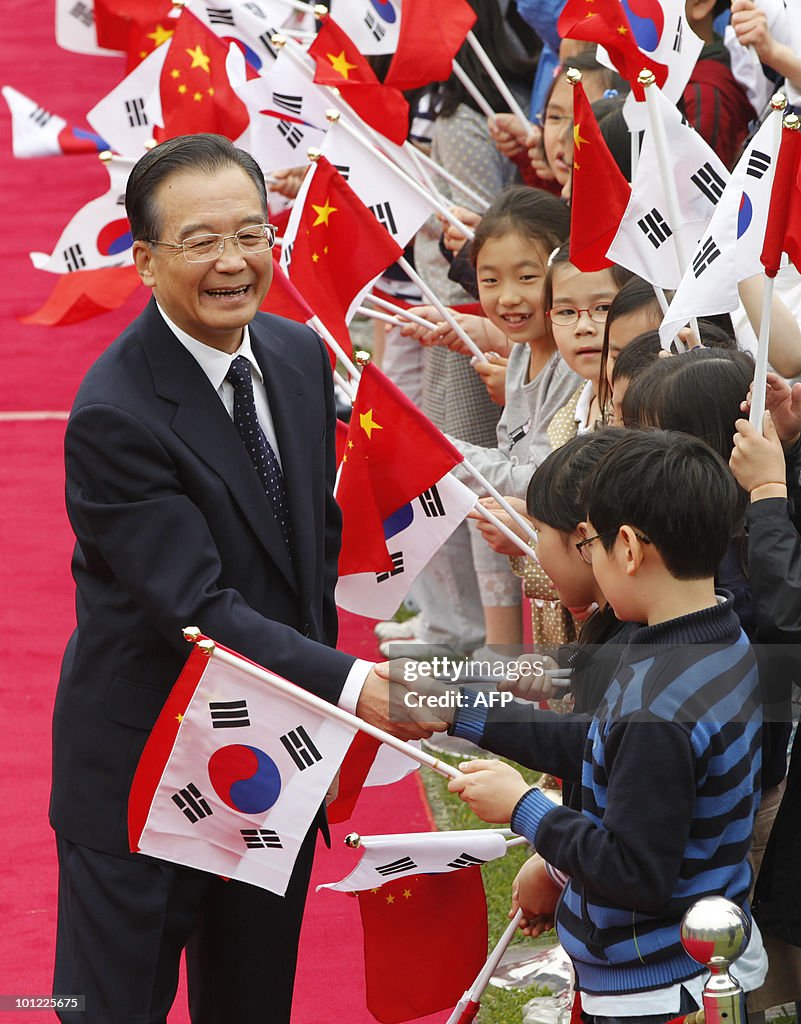 Chinese Premier Wen Jiabao is greeted by