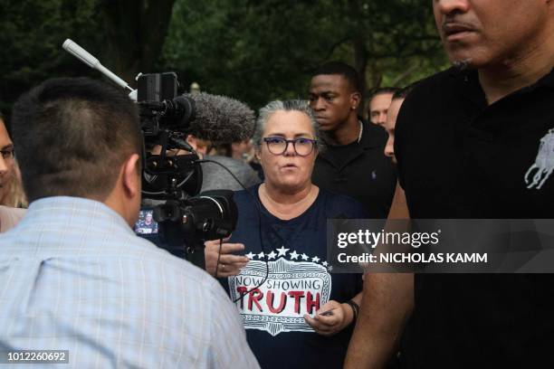 Comedian Rosie O'Donnell speaks to reporters as she leaves a protest against US President Donald Trump in front of the White House in Washington, DC,...