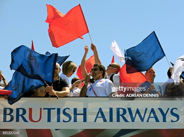 Demonstrators prepare to set off on a double decker bus as they take part in a protest for British Airways cabin crew during the first day of a...