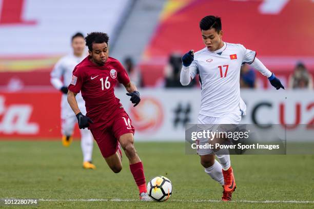 Vu Van Thanh of Vietnam in action against Hashim Ali of Qatar during the AFC U23 Championship China 2018 Semi Finals match between Qatar and Vietnam...