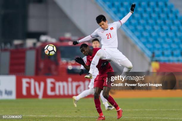 Tran Dinh Trong of Vietnam fights for the ball with Almoez Ali of Qatar during the AFC U23 Championship China 2018 Semi Finals match between Qatar...