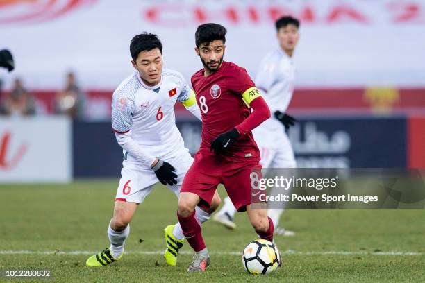 Ahmad Moein of Qatar plays against Luong Xuan Truong of Vietnam during the AFC U23 Championship China 2018 Semi Finals match between Qatar and...