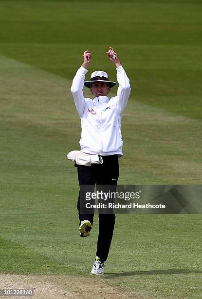 Umpire Billy Bowden signals a six off the batting of Graeme Swann during day two of the 1st npower Test between England and Bangladesh at Lords on...