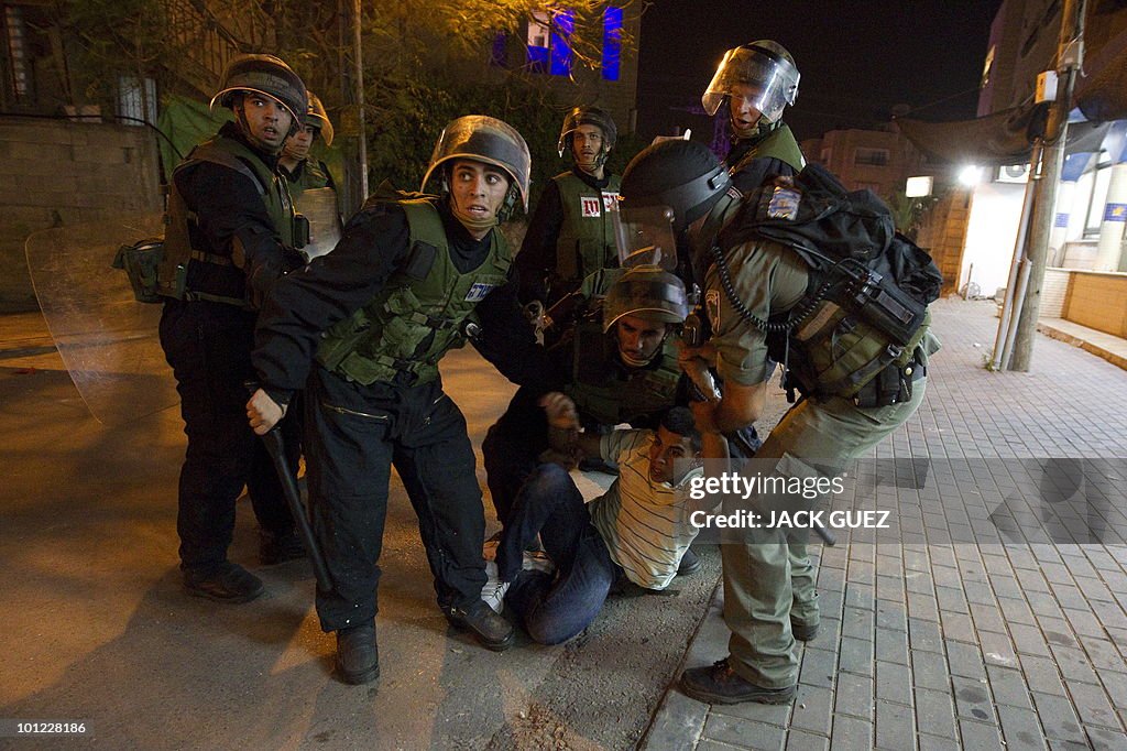 Israeli riot police arrests an Arab Isra