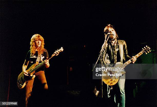 Vicki Blue and Joan Jett of The Runaways perform on stage at Hammersmith Odeon on November 13th, 1977 in London, England.