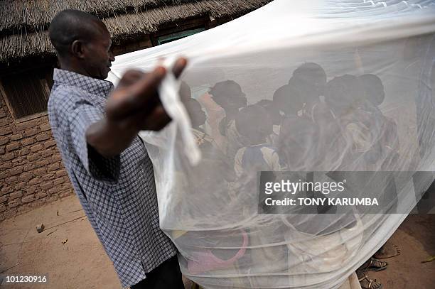 South Sudanese children are educated on the use of a long-lasting insecticide-treated net in Wau, about 520 km northeast of Juba on April 2 where the...