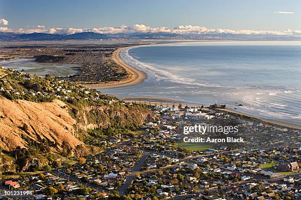 sunny morning at beach town near river mouth - christchurch fotografías e imágenes de stock