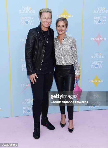 Former soccer player Abby Wambach and author Glennon Doyle arrive at the AT&T & Hello Sunshine launch celebration of "Shine On With Reese" at...