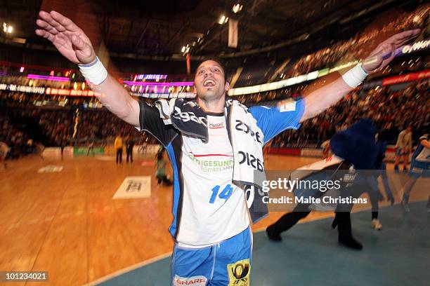 Bertrand Gille of HSV Hamburg celebrates his team's victory after the Bundesliga match between HSV Hamburg and Hannover Burgdorf at the Color Line...