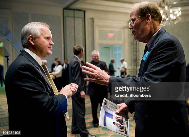 Robert Niblock, chief executive officer of Lowe's Cos., left, speaks with shareholder Harold Eage during the company's annual meeting in Charlotte,...
