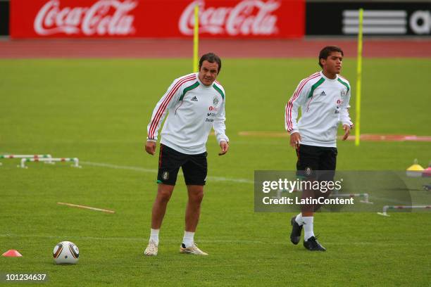 Cuauhtemoc Blanco and Jonathan dos Santos of the Mexican National Team exercise during a training session at the Adidassler Sportplatz on May 28,...