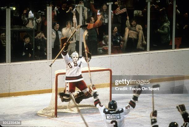 Goaltender Jim Craig of United States Olympic Hockey team jump with jubilation after the United States beat the Soviet Union hockey team in the...