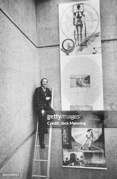 American abstract expressionist painter Robert Rauschenberg at the Whitney Museum of American Art with his lithograph 'Rauschenberg Autobiography',...