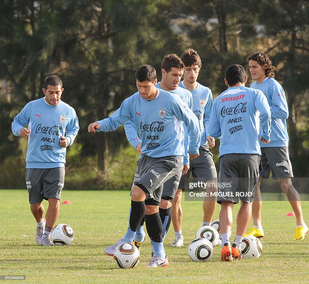 Footballer Ignacio Gonzalez (C) controls