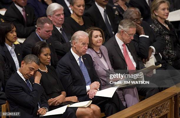 President Barack Obama wipes a tear from his eye as he attends the funeral service for Dorothy Height at Washington National Cathedral in Washington,...