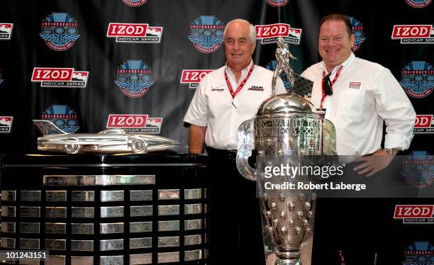 Roger Penske owner of Team Penkse and Chip Ganassi owner of Target Chip Ganassi Racing Team pose next to the Harley J. Hearl Daytona 500 Trophy and...