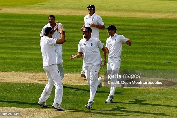 Kevin Pietersen of England celebrates with team mates as he runs out Tamim Iqbal of Bangladesh with a direct hit during day 2 of the 1st npower Test...