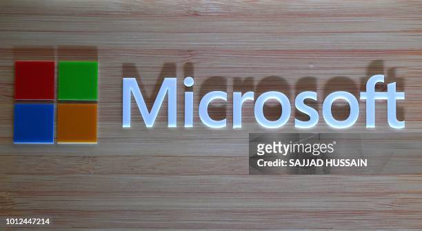 The logo of Microsoft is pictured during the launch of Surface Book 2 and Surface Laptop at a promotional event in New Delhi on August 7, 2018.
