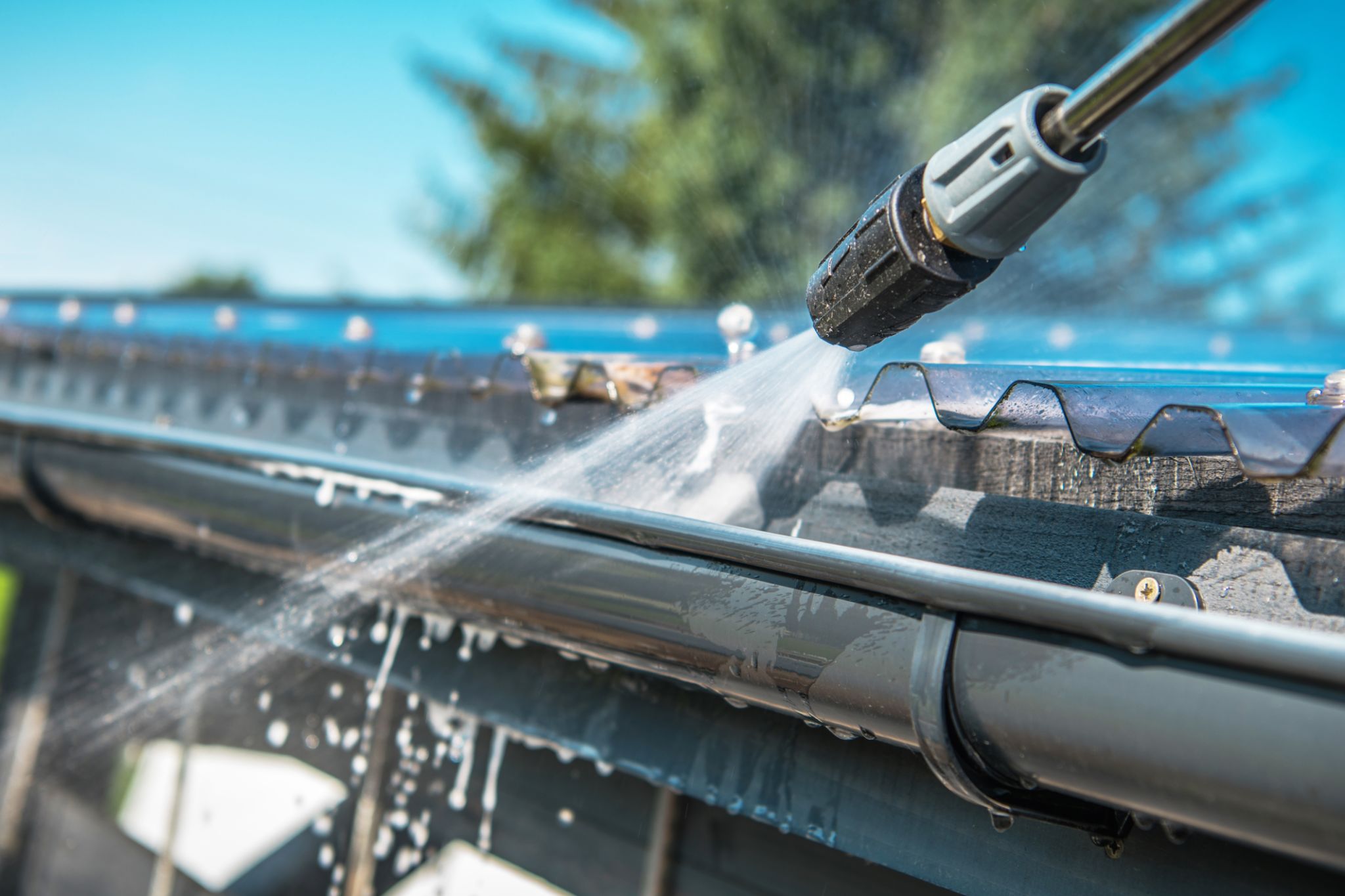 homeowner cleaning roof
