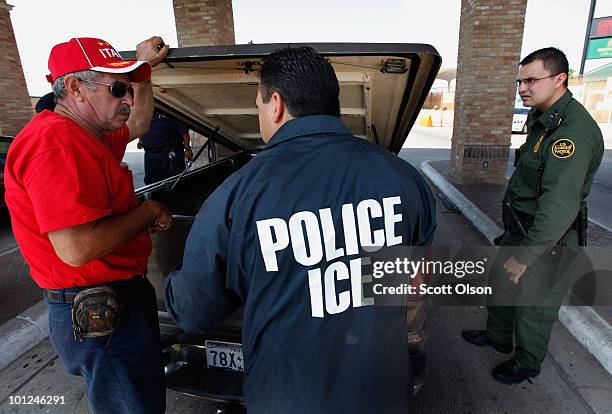 Special agents from Immigration and Customs Enforcement , Border Patrol, and Customs and Border Protection question a man while his vehicle is...