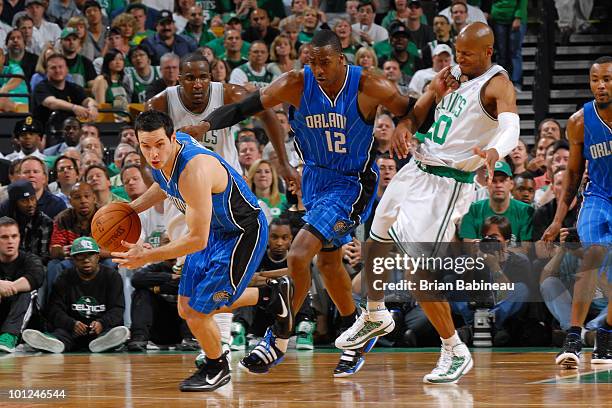Redick of the Orlando Magic moves the ball upcourt against Ray Allen of the Boston Celtics in Game Six of the Eastern Conference Finals during the...