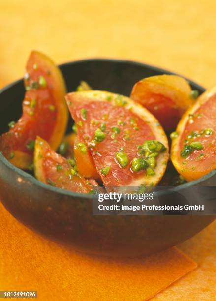 pink grapefruit salad with pistachios - pink grapefruit stock pictures, royalty-free photos & images