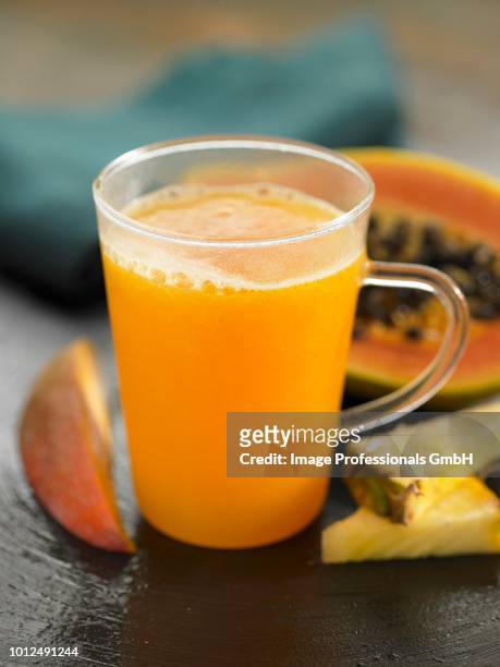 papaya,pineapple and mango smoothie - mango stock pictures, royalty-free photos & images