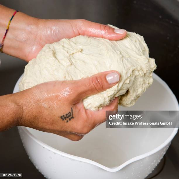 kneading the dough - seitan foto e immagini stock