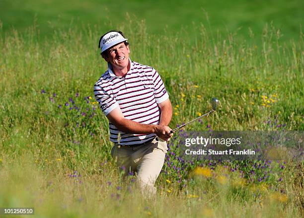 Gonzalo Fernandez - Castano of Spain plays his approach shot on the third hole during the third round of the Madrid Masters at Real Sociedad Hipica...