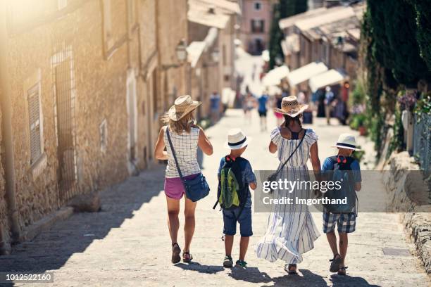 tourist family walking on famous stairs in beautiful city of pollensa - pollenca steps stock pictures, royalty-free photos & images