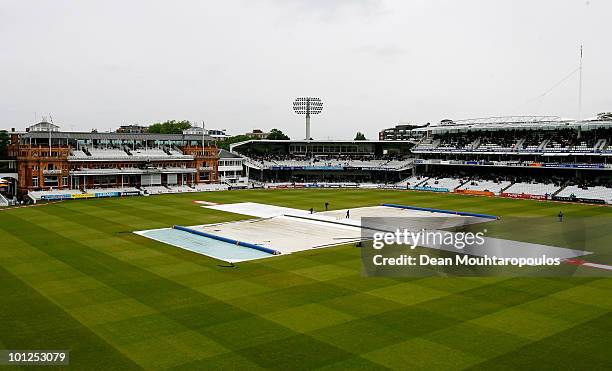 The Rain covers stay on for the morning session in front of the Pavilion during day 3 of the 1st npower Test between England and Bangladesh played at...