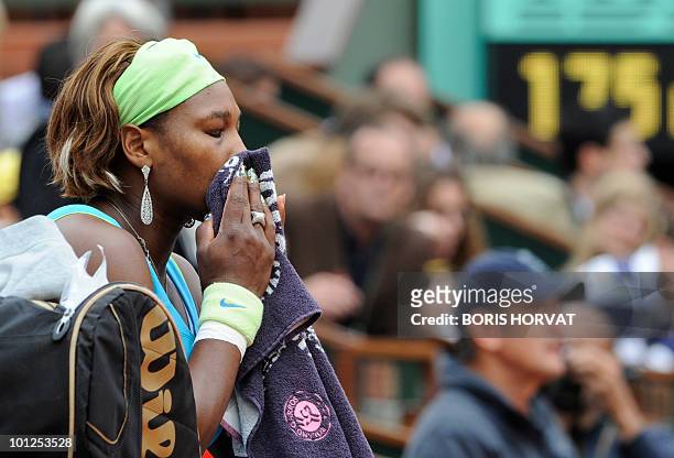 Serena Williams reacts during her women's third round match against Russia's Anastasia Pavlyuchenko in the French Open tennis championship at the...