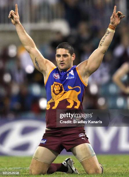 Brendan Fevola of the Lions celebrates after kicking the match winning goal during the round 10 AFL match between the Brisbane Lions and the...