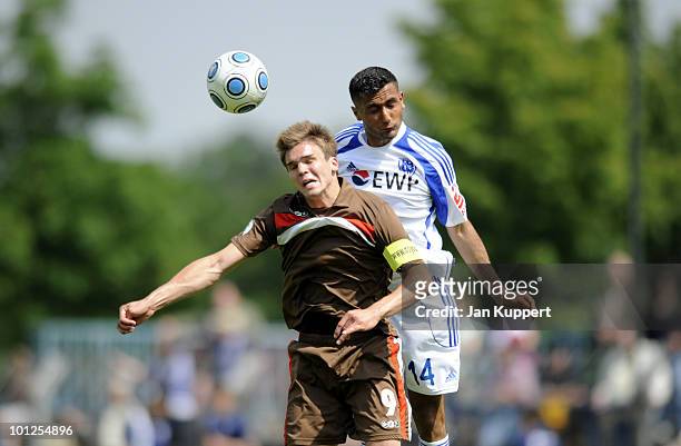 Nils Pichinot of St.Pauli and Joan Oumari of Babelsberg head for the ball during the Regionalliga match between SV Babelsberg and FC St. Pauli at the...