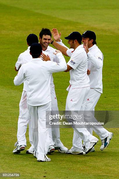 James Anderson of England celebrates with team mates after taking the wicket of Shakib Al Hasan of Bangladesh during day 3 of the 1st npower Test...