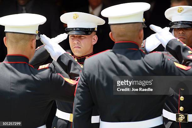 Marine pallbearers salute as the flag drapped casket with U.S. Marine Lance Corporal Patrick Xavier Jr.'s body is brought out of the St. David's...