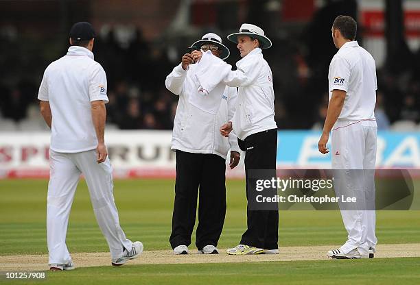 Asoka De Silva and Billy Bowden check the light before they stop play during day 3 of the 1st npower Test match between England and Bangladesh at...