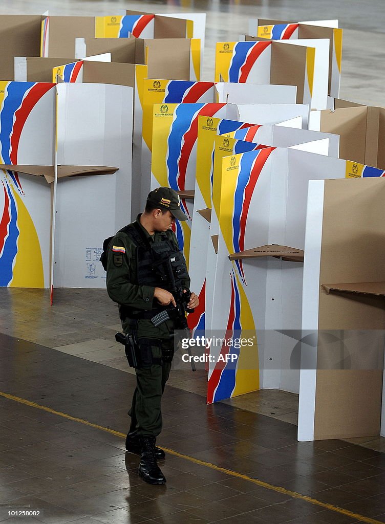 A Colombian police officer keeps watch o