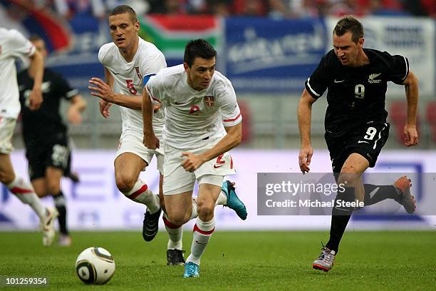 Shane Smeltz of New Zealand chases down Antonio Rukavina during the New Zealand v Serbia International Friendly match at the Hypo Group Arena on May...