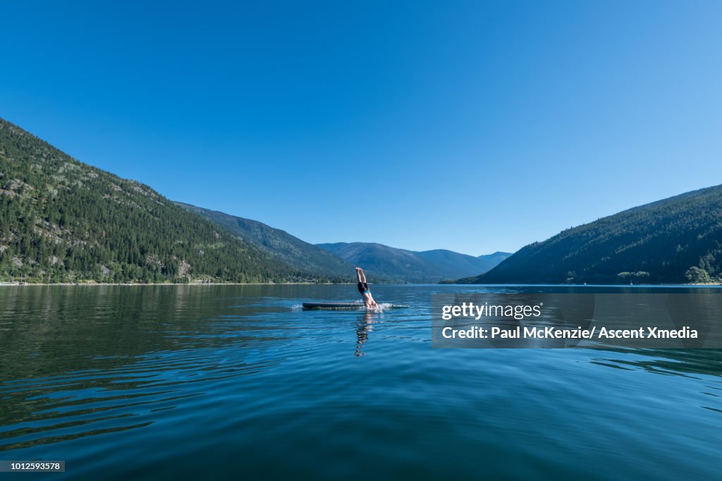 Man dives into mountain lake